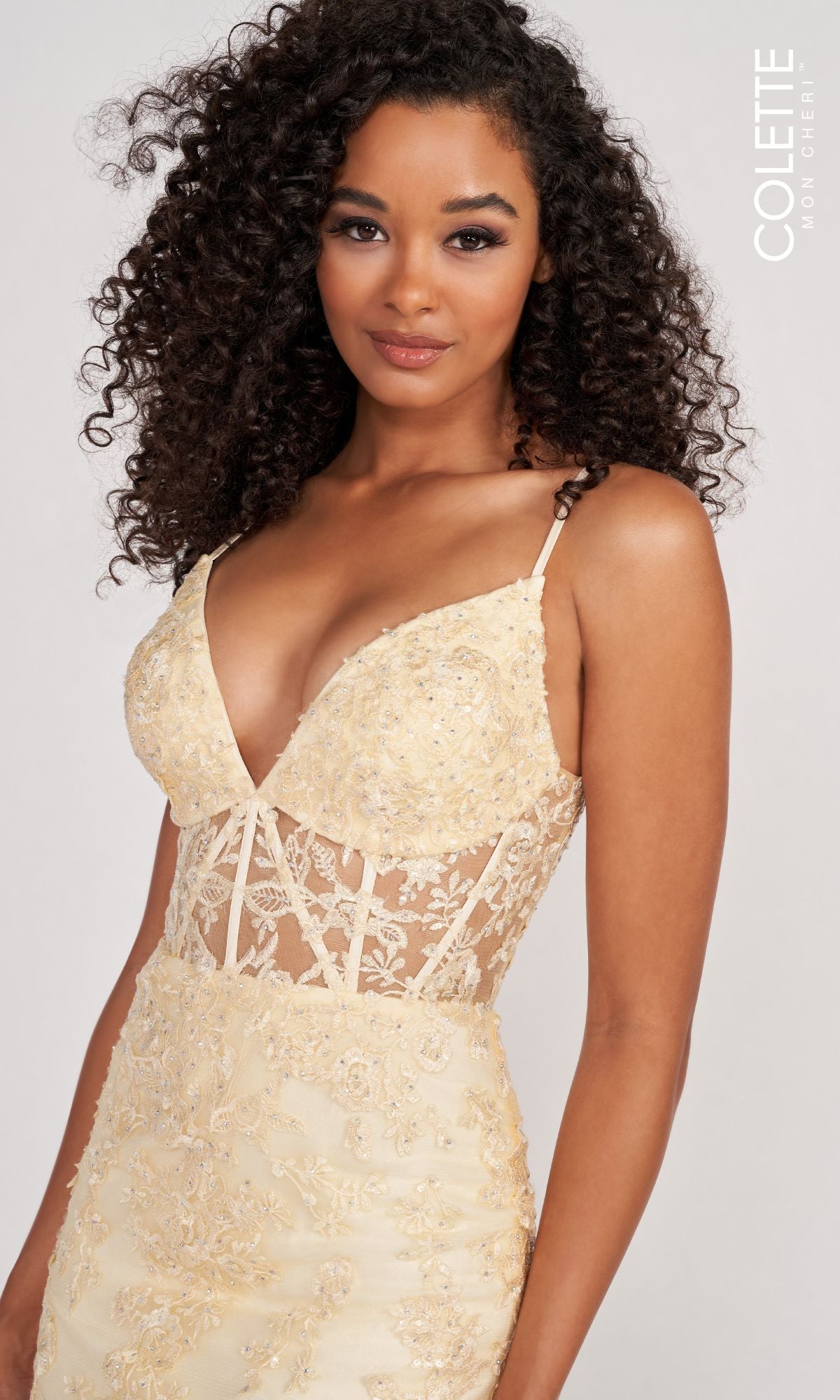 Woman wearing the Colette Beaded-Lace Long Prom Dress with corset, featuring spaghetti straps and a sheer midsection, standing against a neutral background.